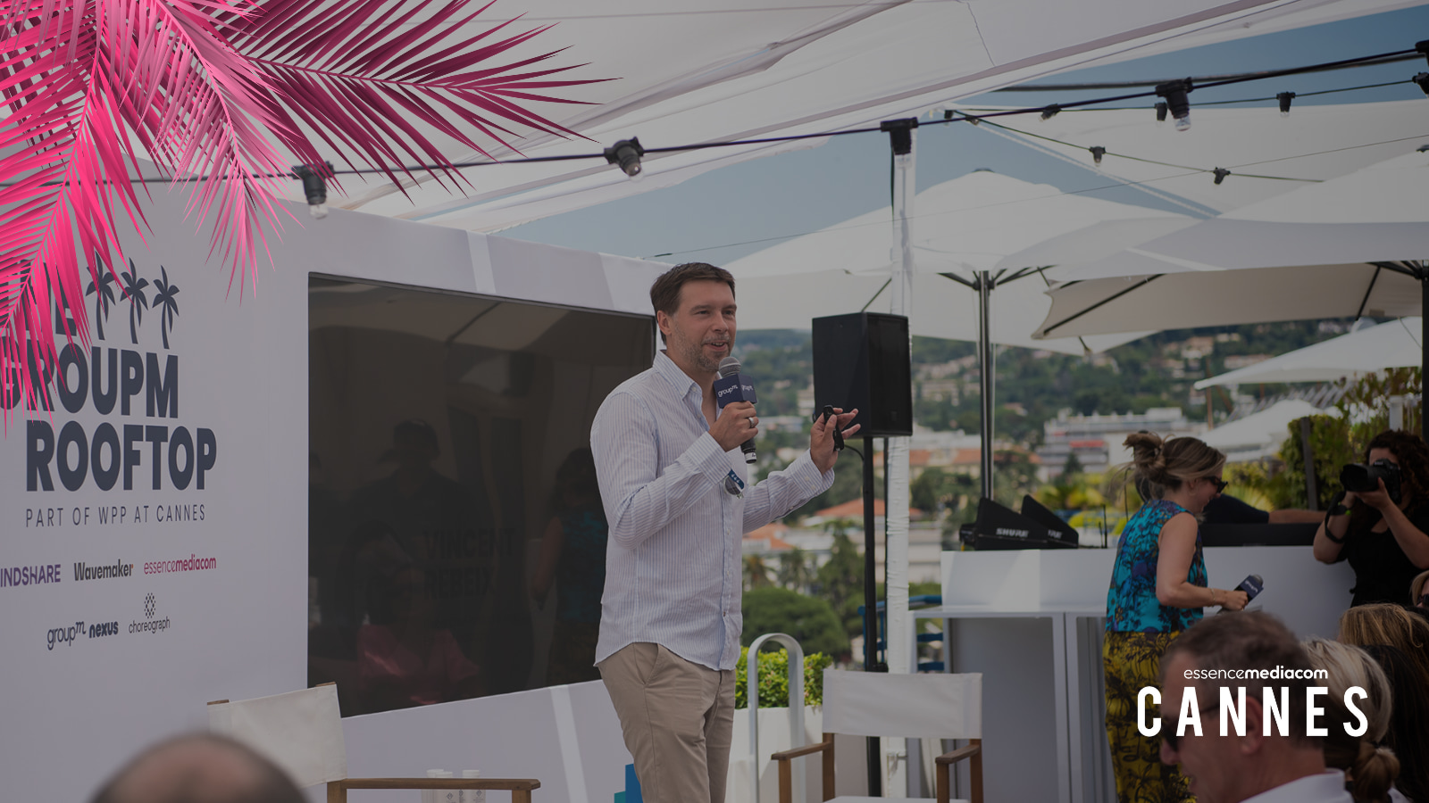 An image of Vincent Rebeix holding a mic at the EssenceMediacom panel on Generative AI at Cannes