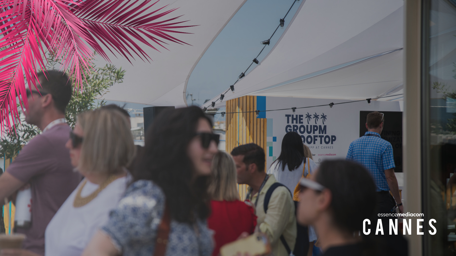 People talking and networking at the GroupM rooftop in Cannes