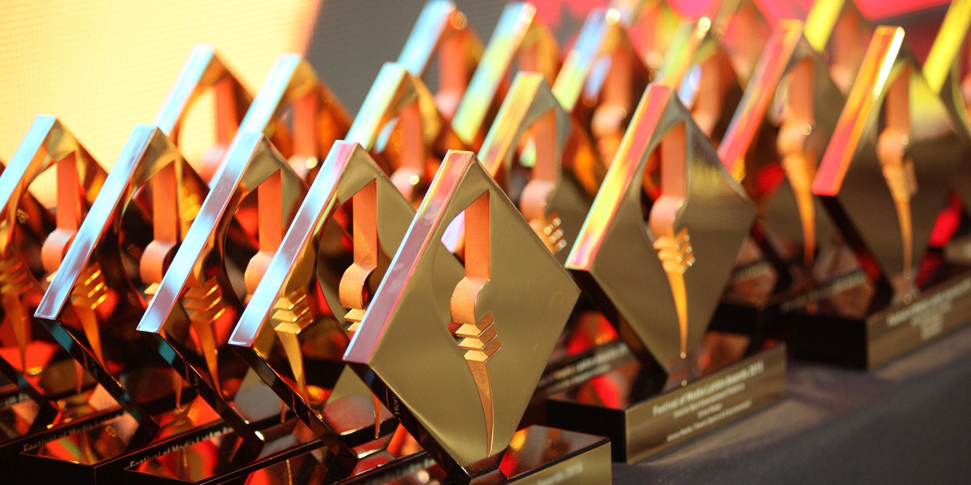 Rows of festival of media awards on a table