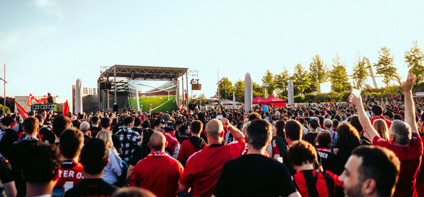 Image of Bayer Leverkusen fans watch a match in a fan park