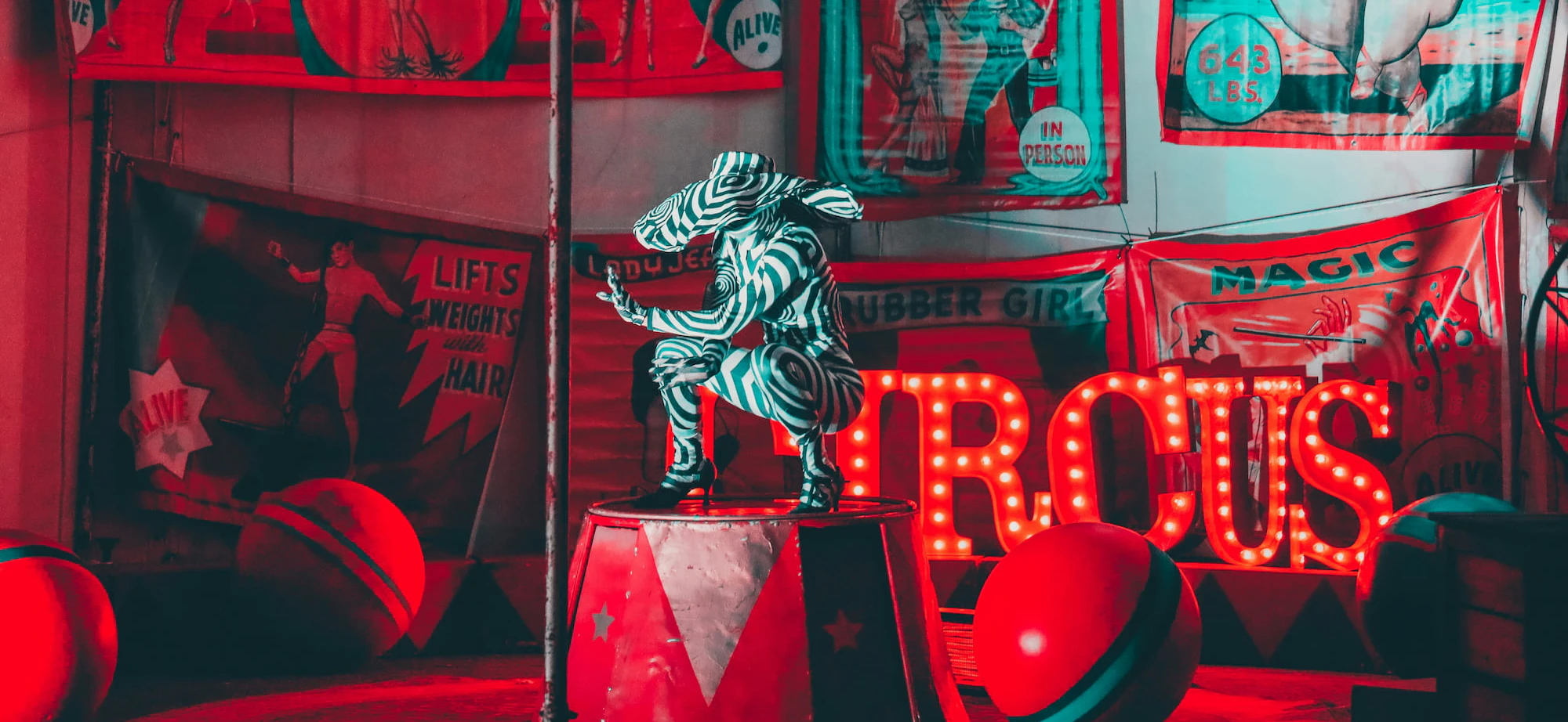 Circus red and white neon sign - Photo by JOSHUA COLEMAN on Unsplash