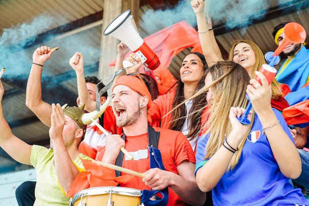 Football supporter fans watching world soccer match at stadium