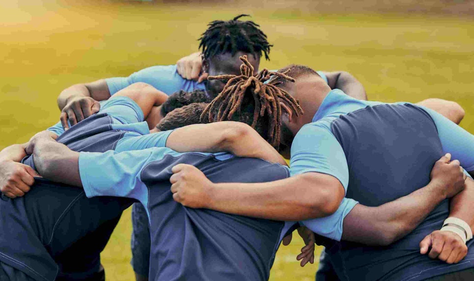 Diversity, team and men huddle in sports for support, motivation or goals outdoors