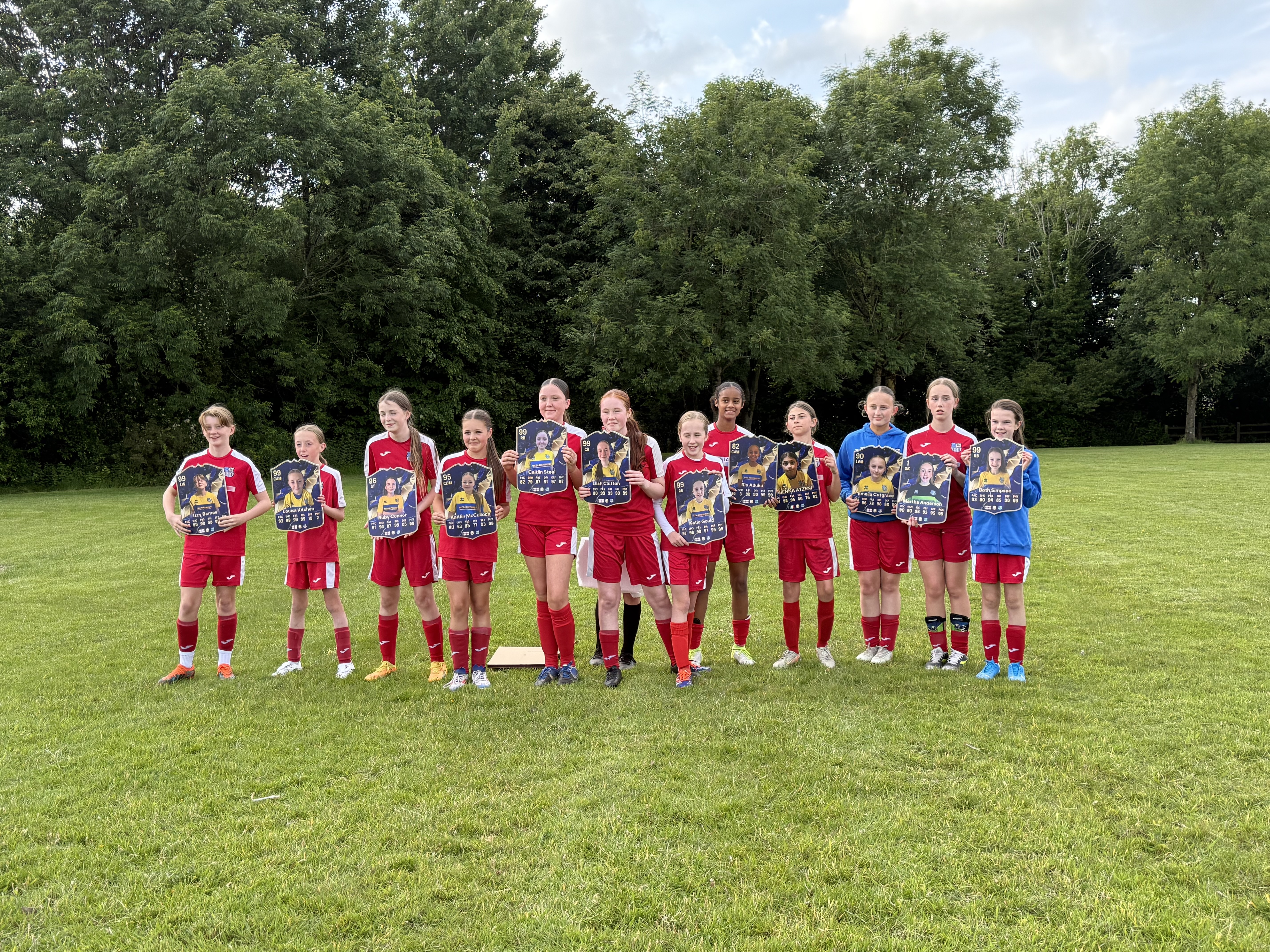 A lineup of players holding a CC card in hand.