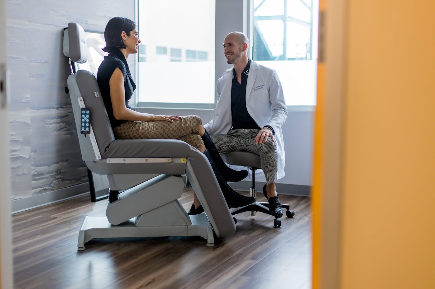 doctor speaking to client sitting down together