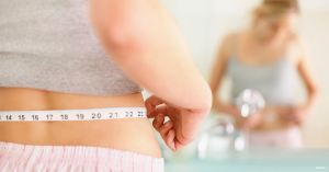 Woman considering tummy tuck surgery