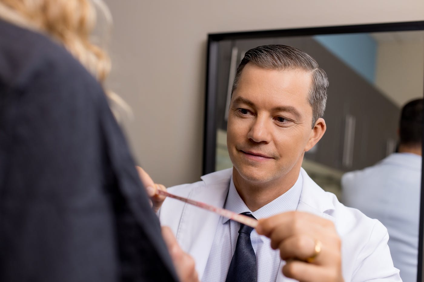 doctor measuring client