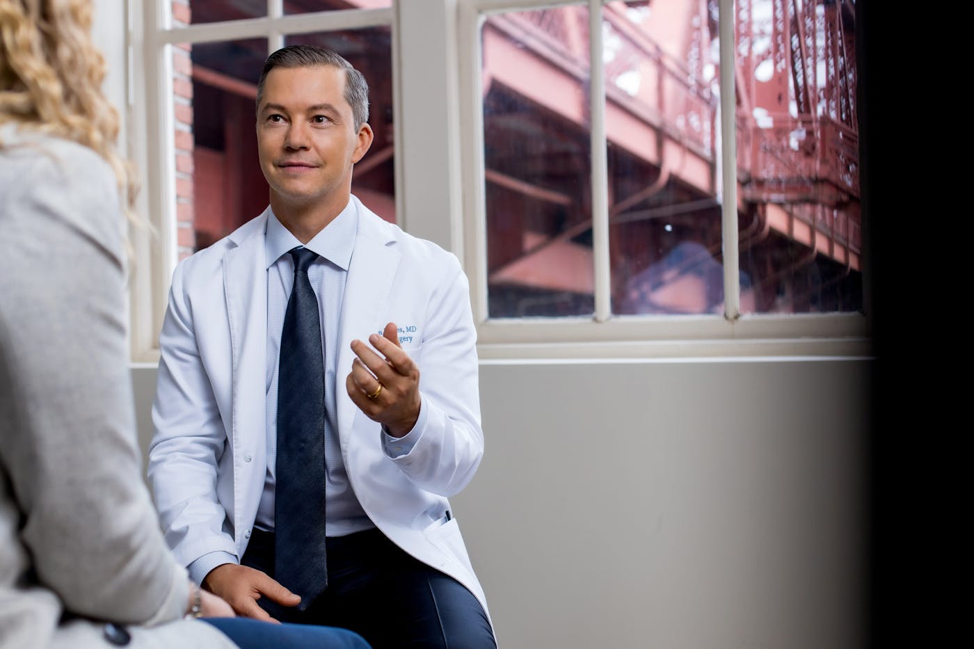 Dr. Hayes speaking with a patient