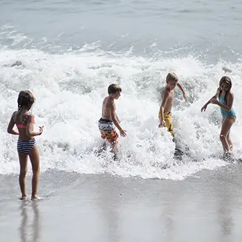 children playing on the beach