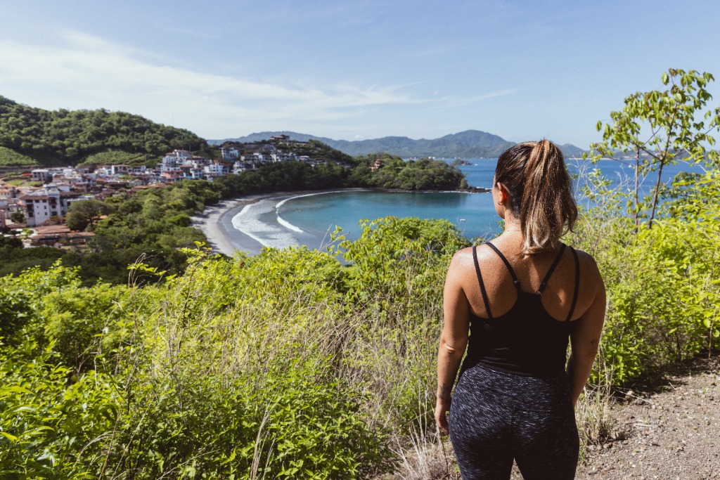 a woman walking on a trail