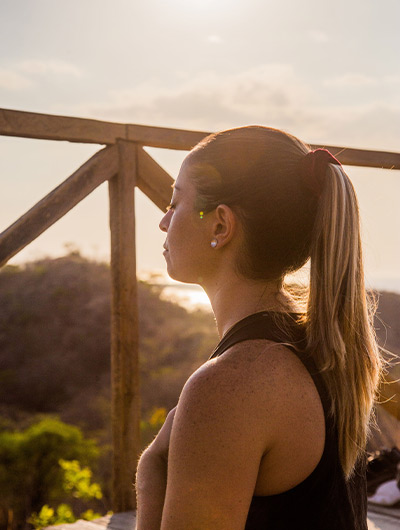 woman meditating during dusk