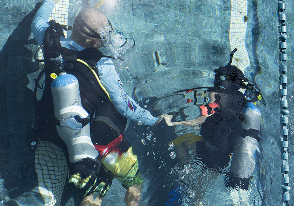 scuba divers in water
