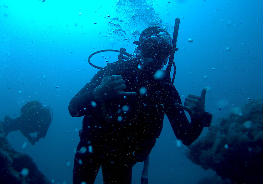 a scuba diver swimming in the ocean