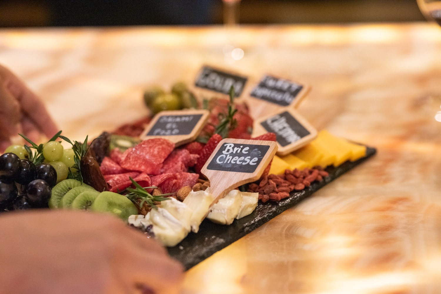 a charcuterie board being placed on a table