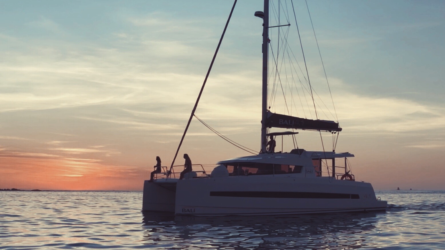 a boat on water at sunset
