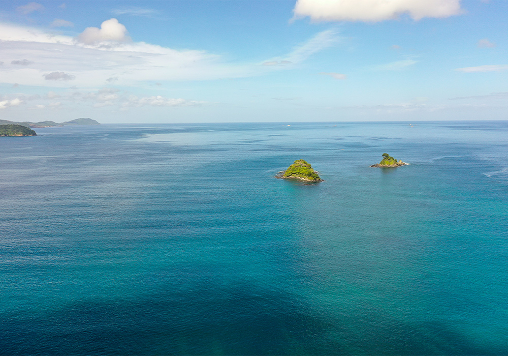blue water with islands in the distance