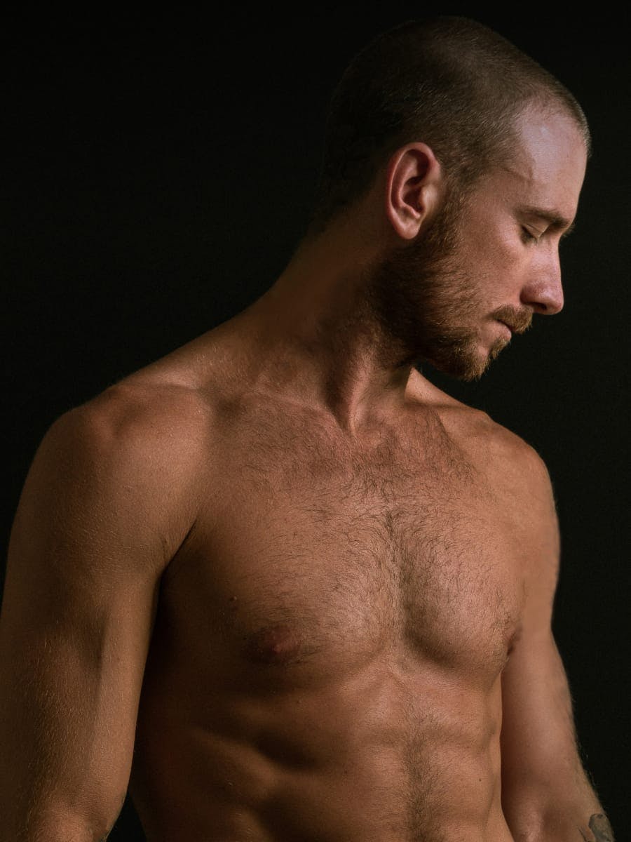Photo of a toned man with short hair