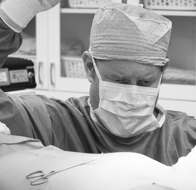 plastic surgeon performing surgery