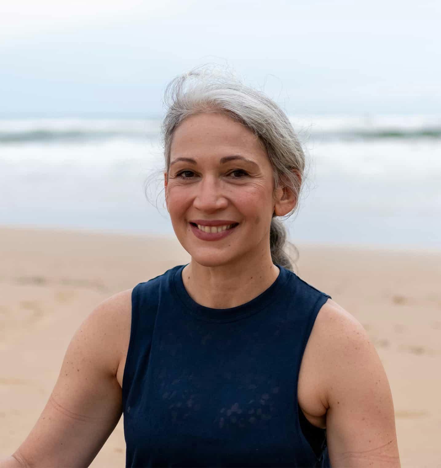 Woman on the beach smiling