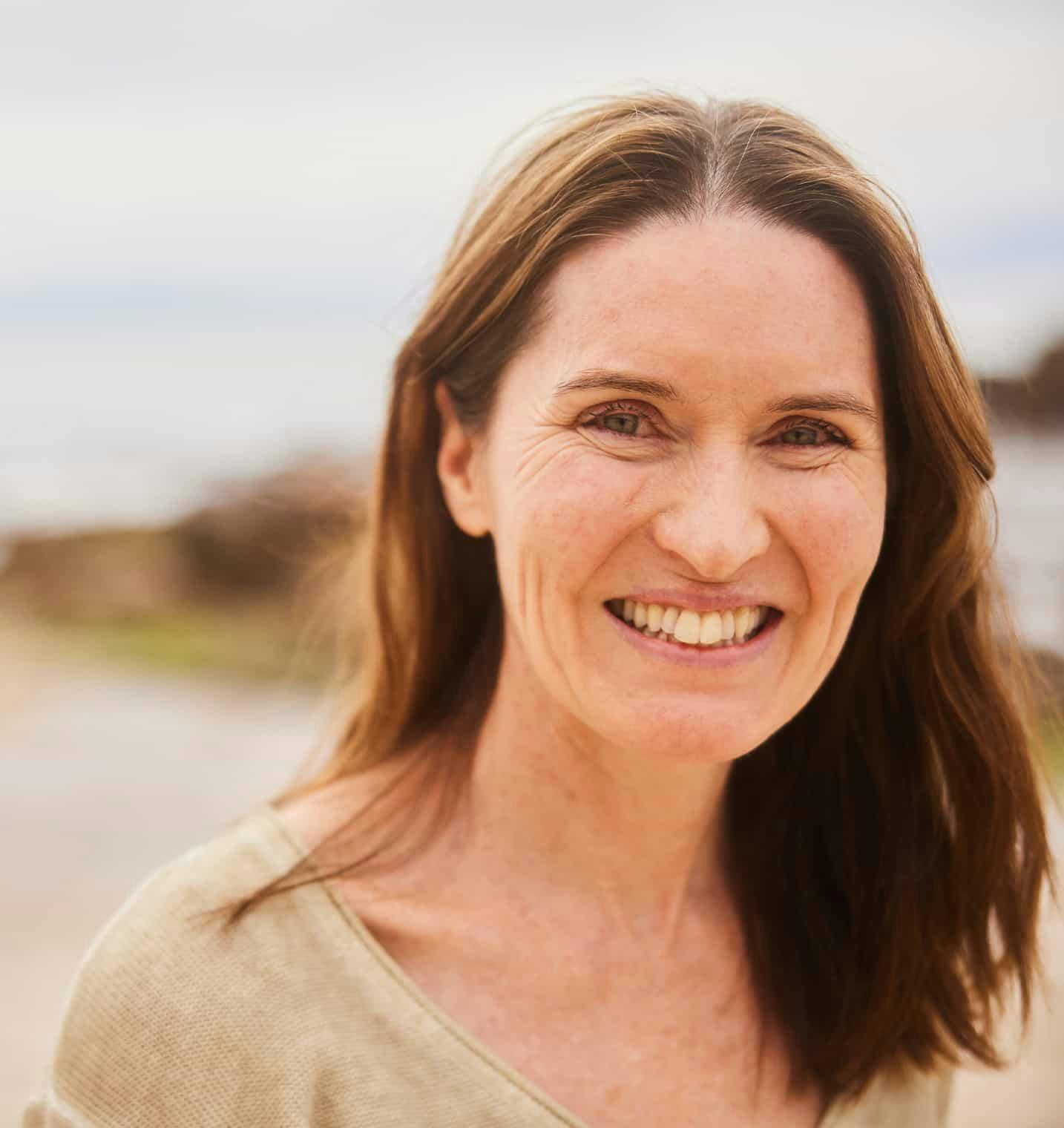 Woman outside smiling