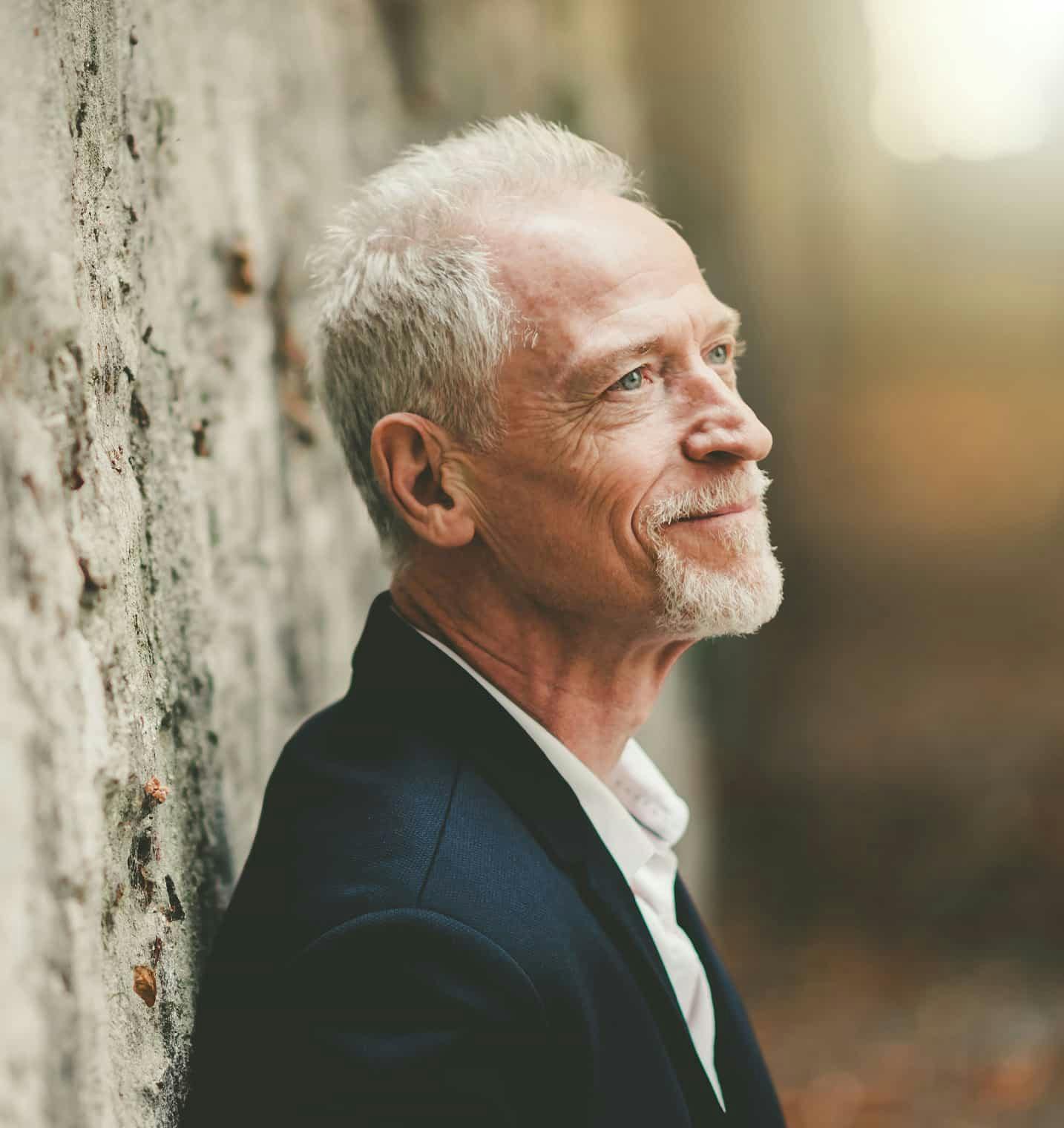 Man in blazer smiling