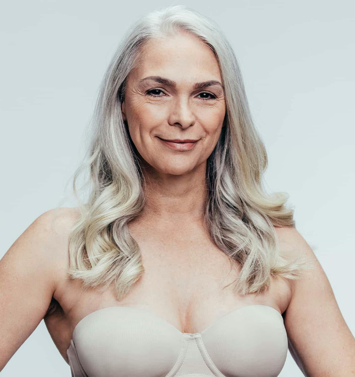 Woman in a bra smiling