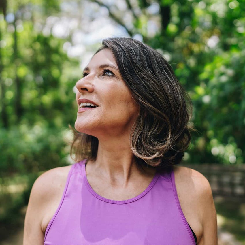 Woman outside smiling
