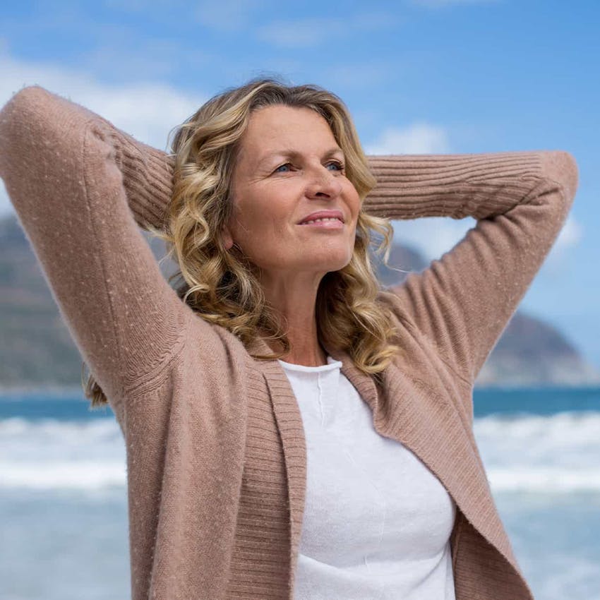 Woman smiling at the beach