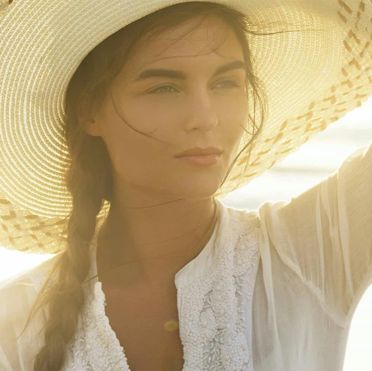 woman in a hat outside