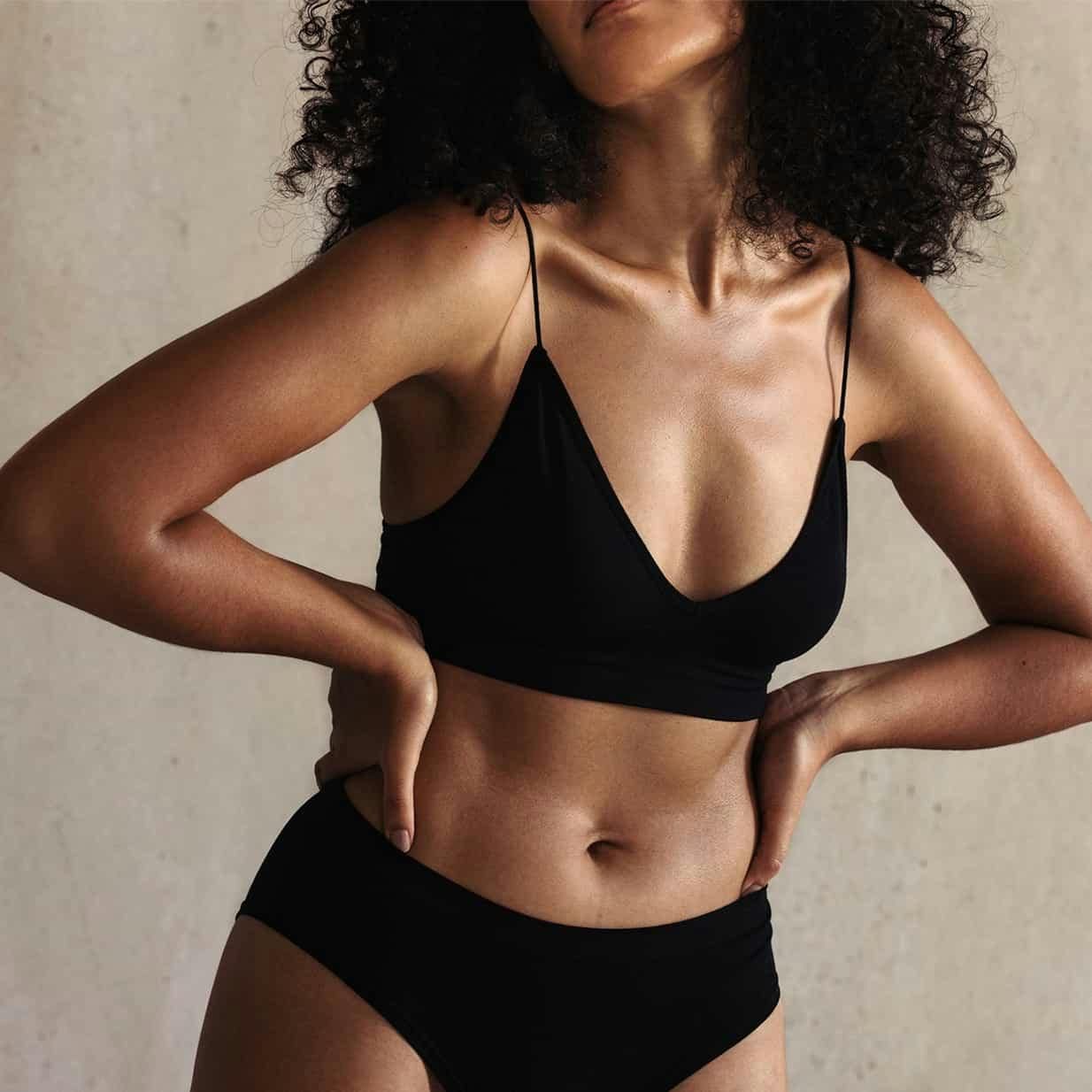 Woman posing in black underwear