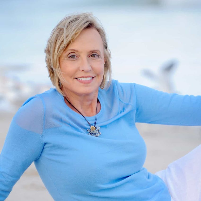 Woman on the beach smiling