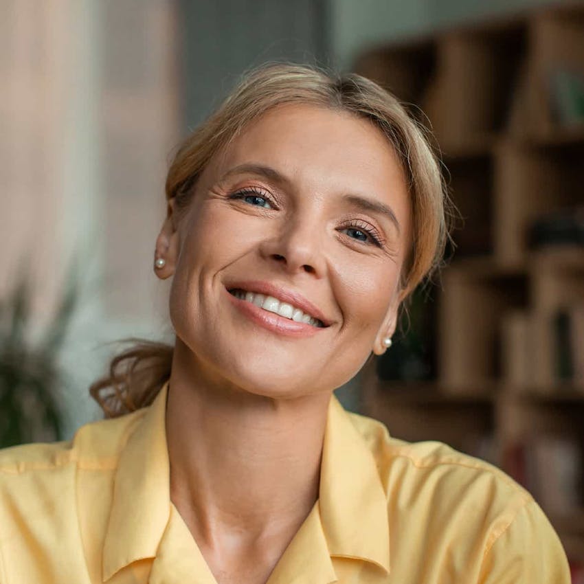 Woman in yellow blouse