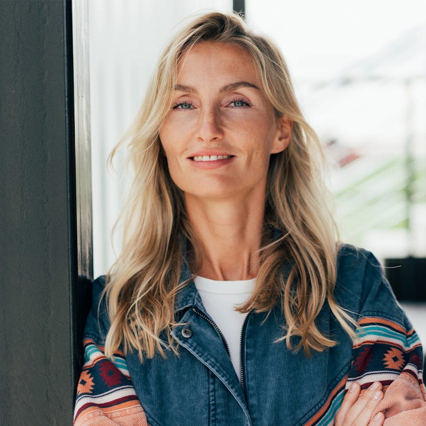 Woman smiling with arms crossed