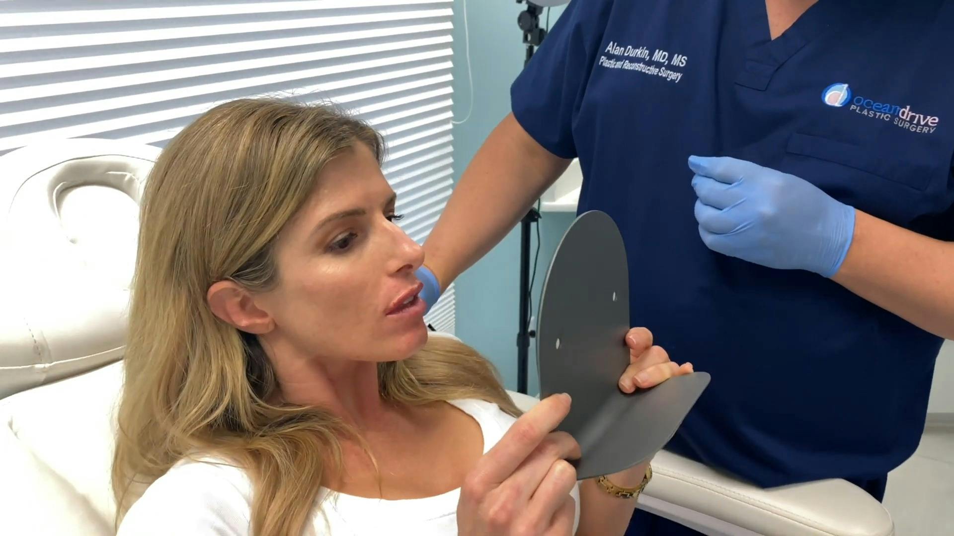 woman looking on the mirror