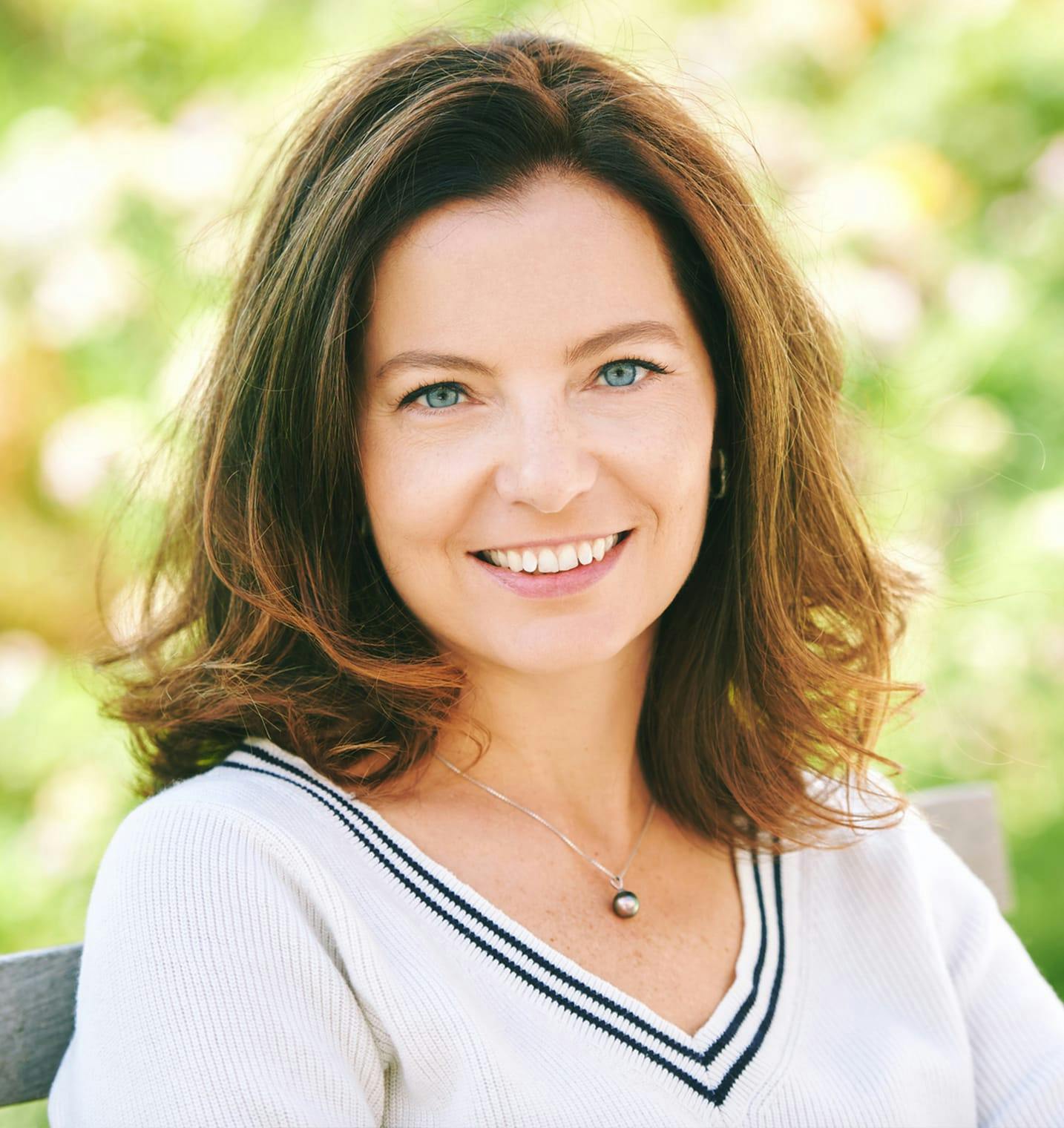 woman sitting and smiling