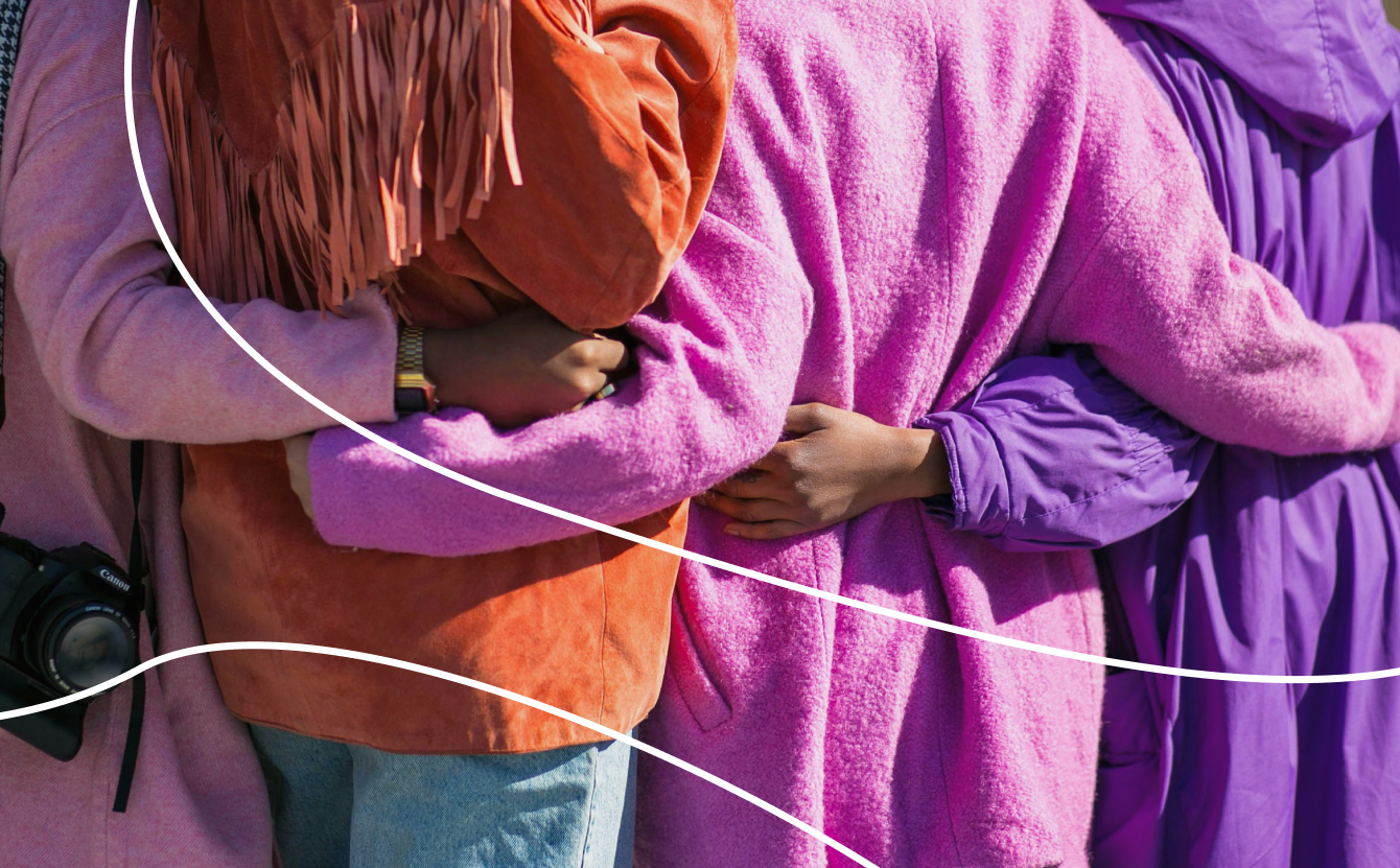 Women linking arms in solidarity