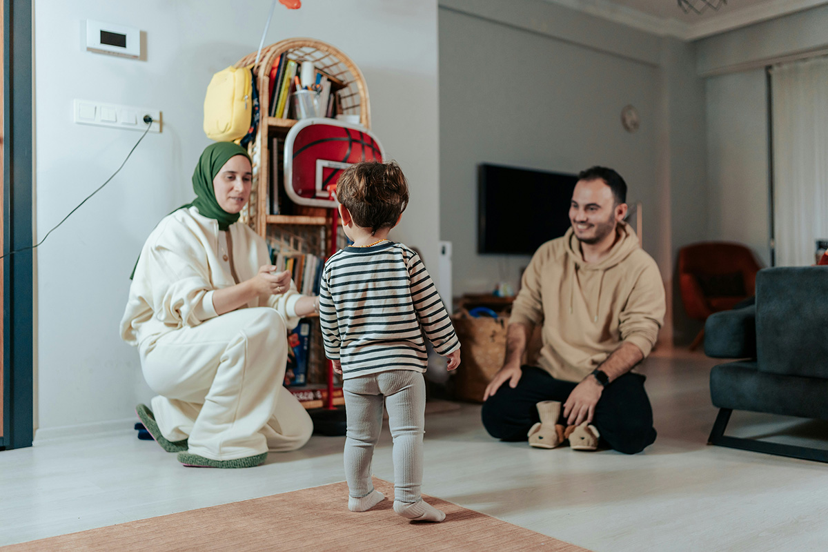 Parents with their young toddler in a home