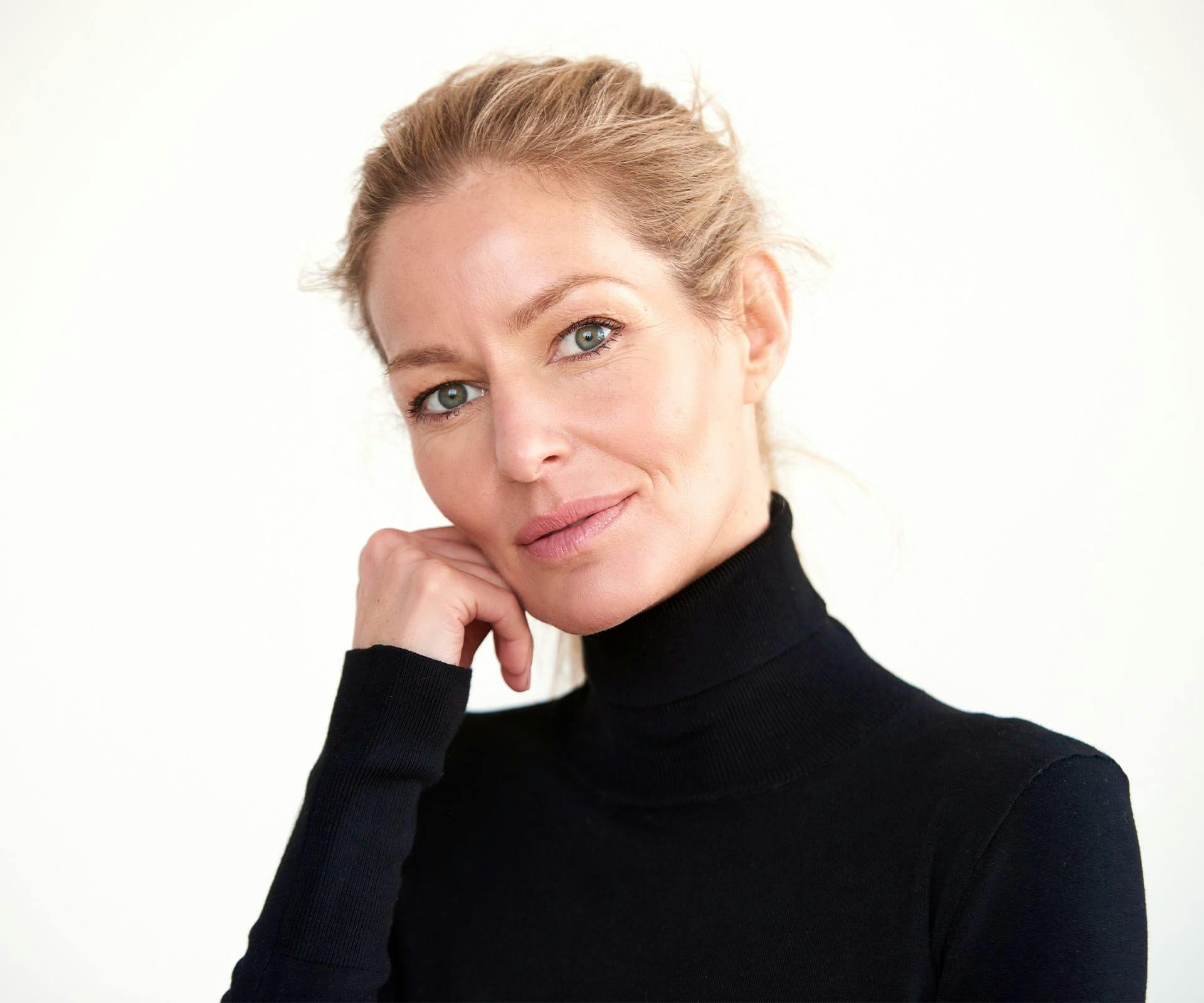 woman in black turtleneck