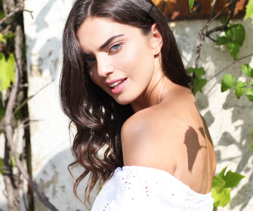 woman smiling over shoulder