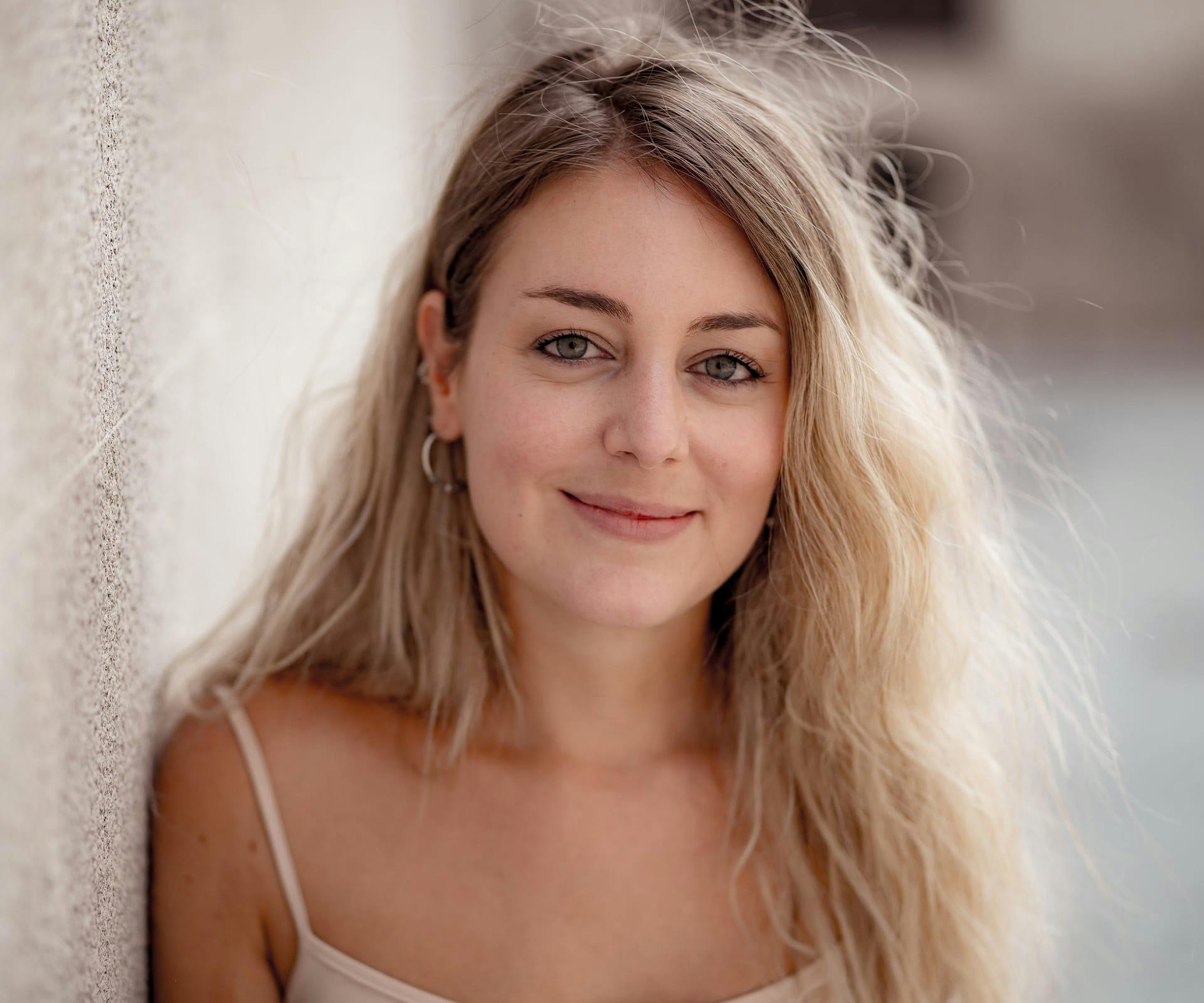 Woman with frizzy hair smiling