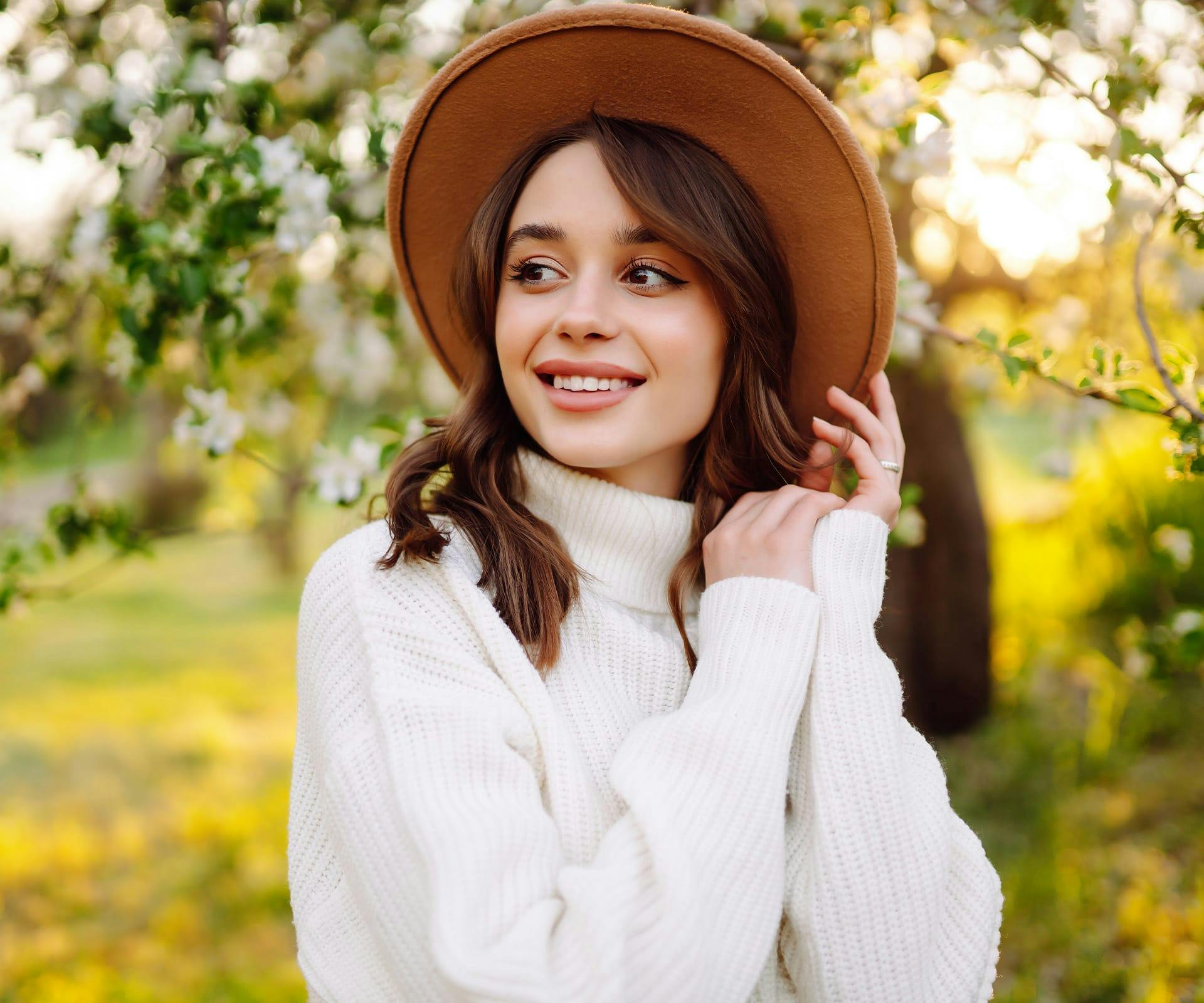 woman in white turtleneck sweater
