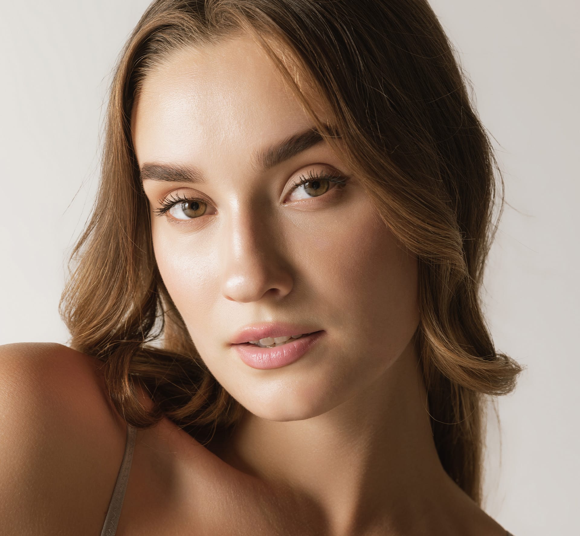 Woman with wavy brown hair