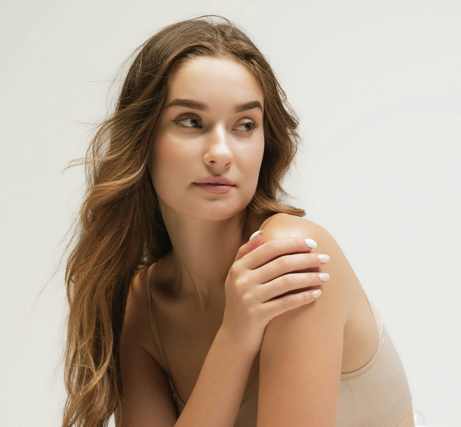 Woman smiling over her shoulder