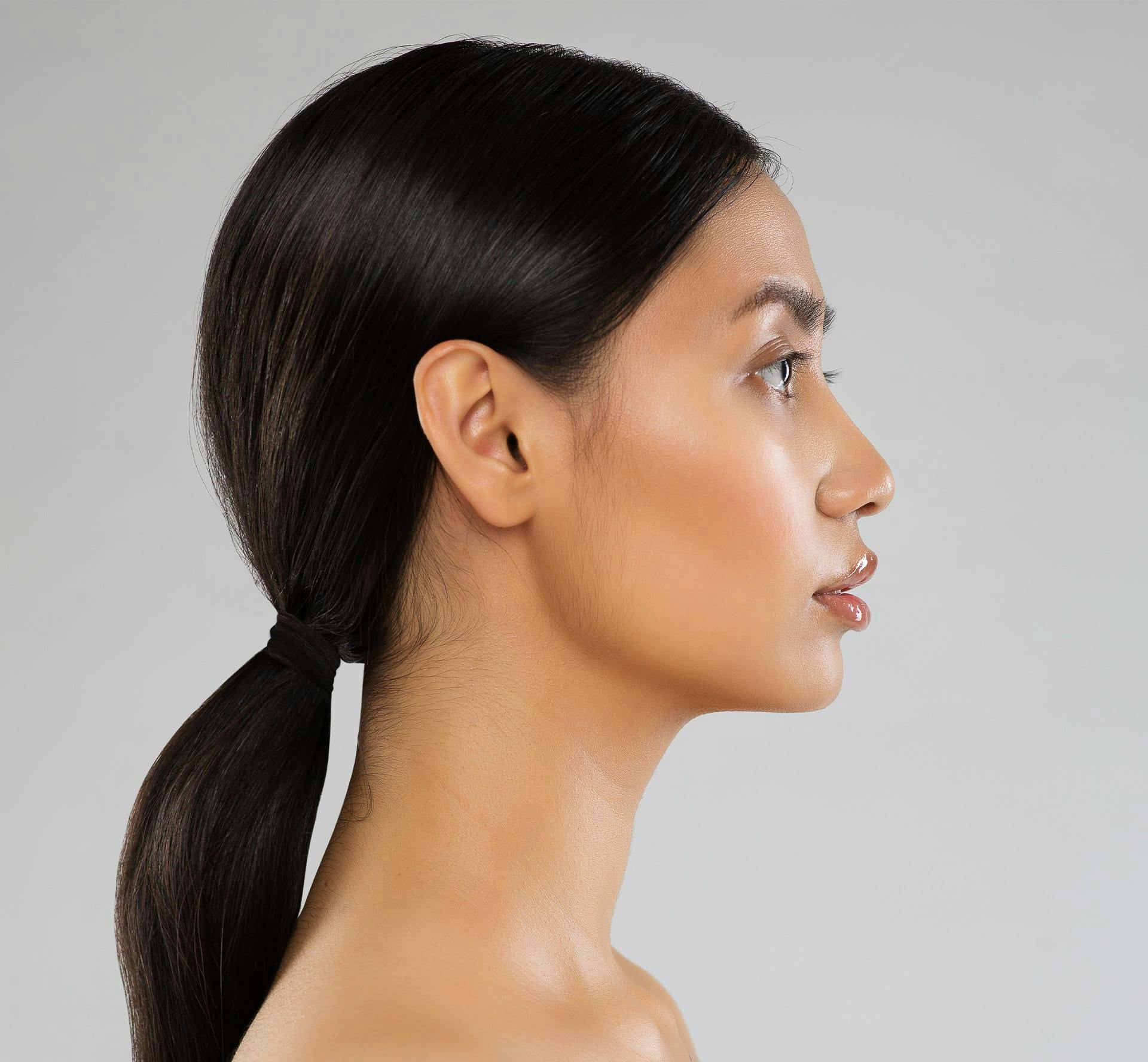 Woman with dark brown ponytail