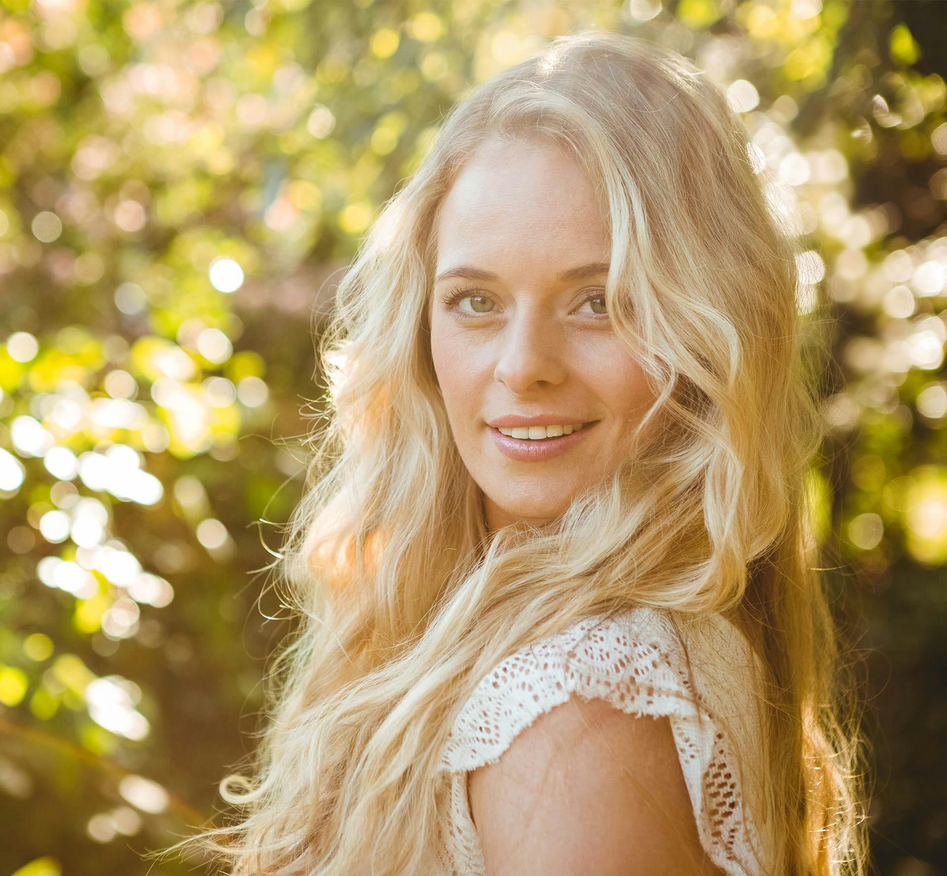 woman smiling in the sun