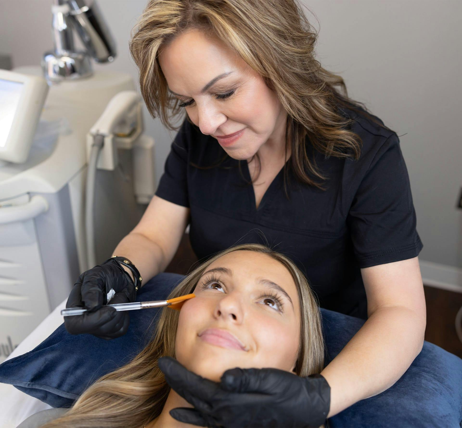 Woman receiving skin treatment