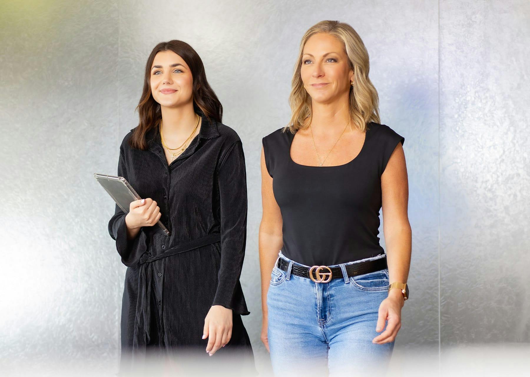 two women dressed nciely