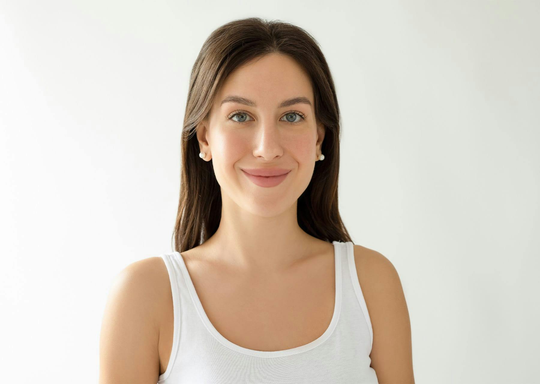 woman in a white tank top