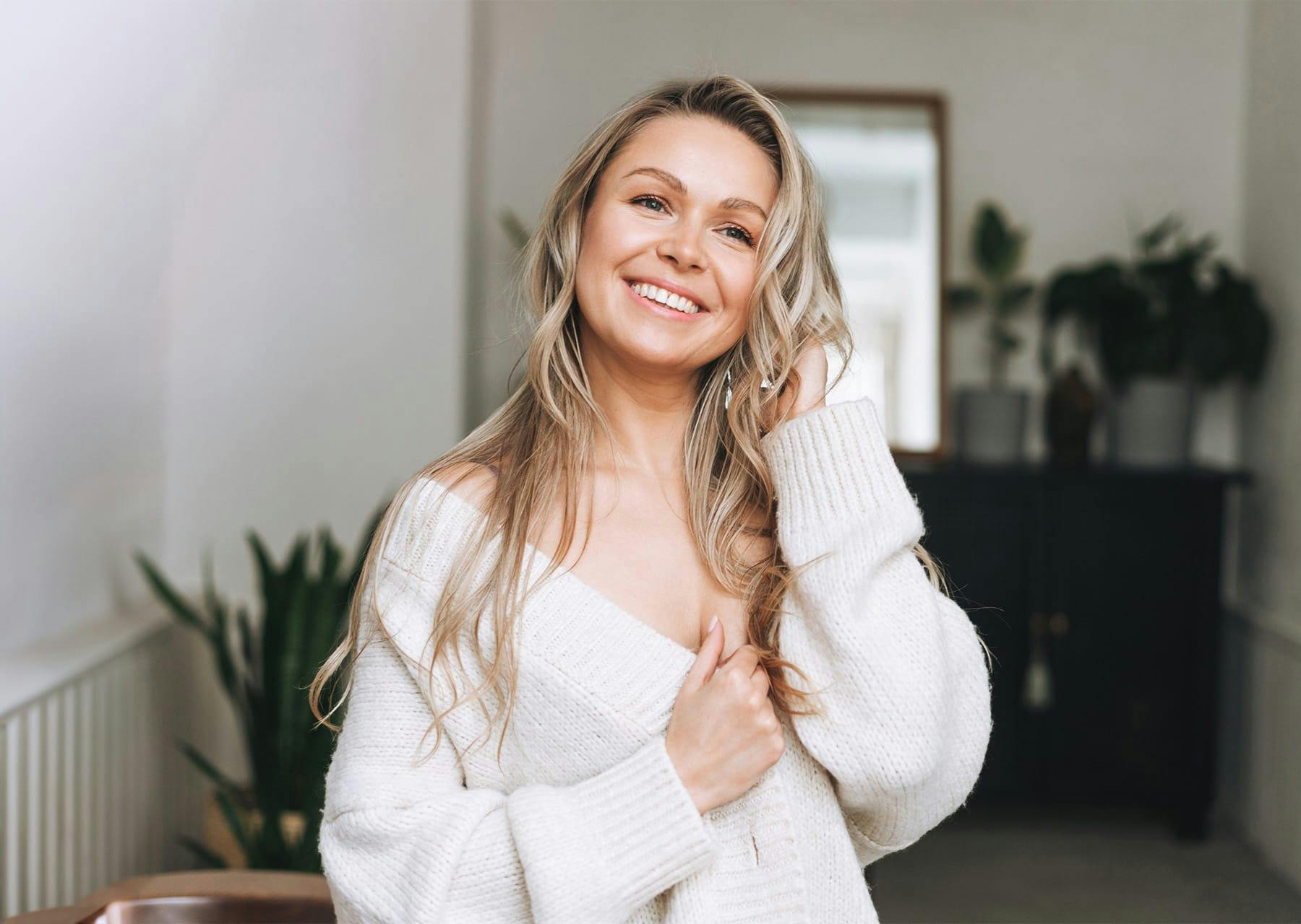 Woman in white sweater