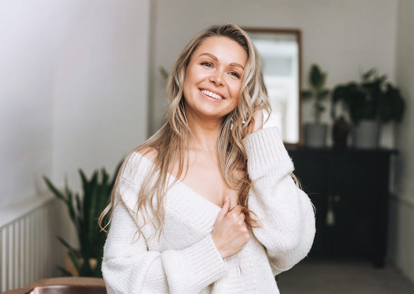 Woman in white sweater